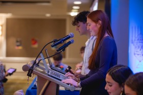 Group of people celebrating on stage