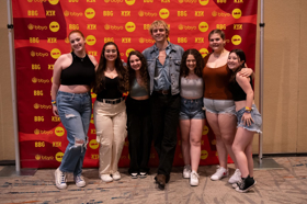 Group of people celebrating on stage