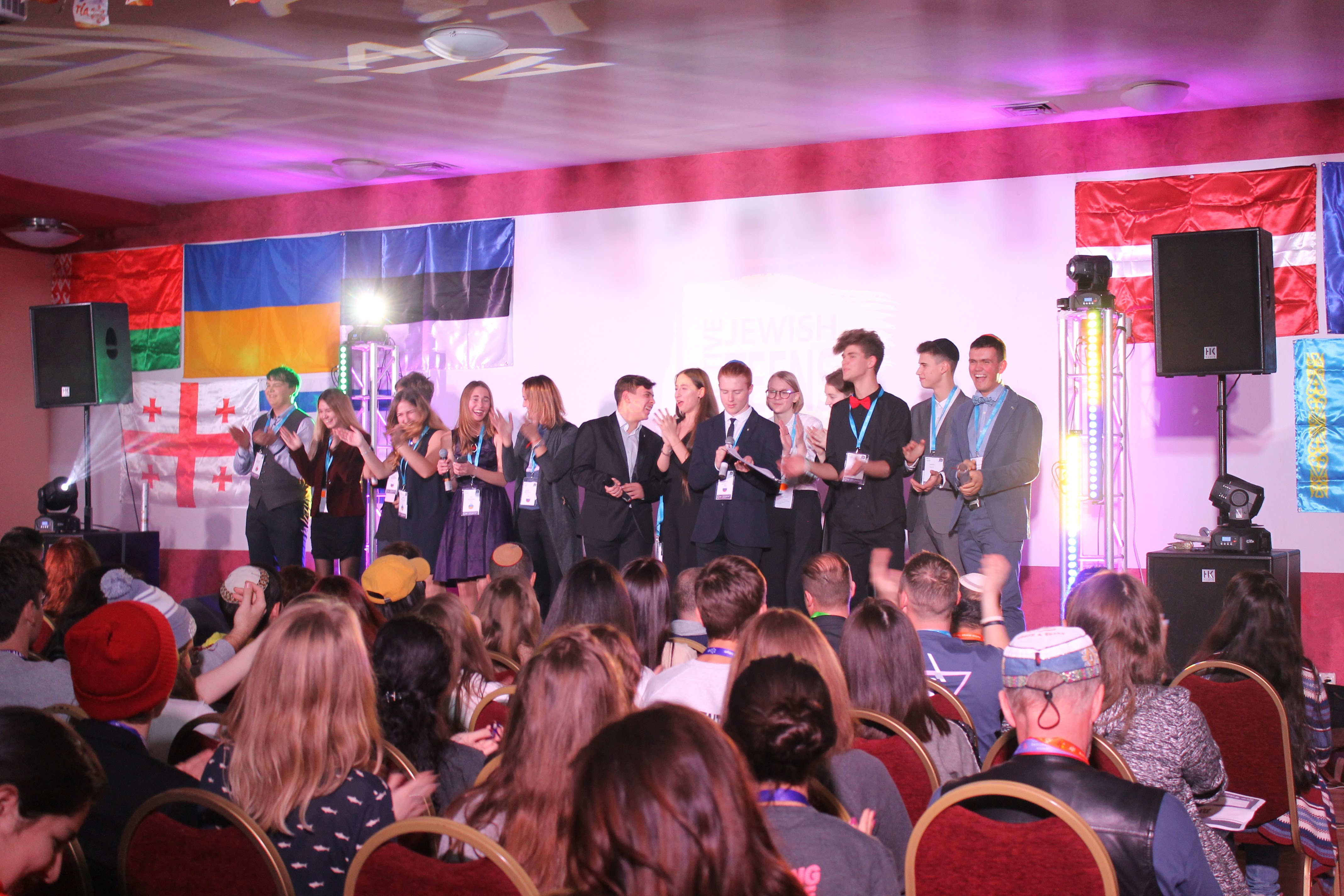 Group of people celebrating on stage