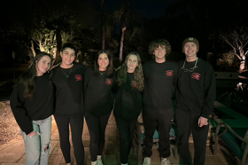 Group of people celebrating on stage