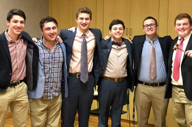 Group of people celebrating on stage