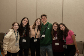 Group of people celebrating on stage