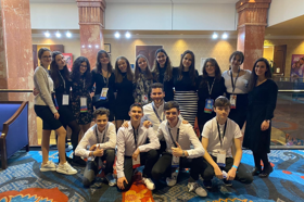 Group of people celebrating on stage