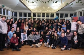 Group of people celebrating on stage