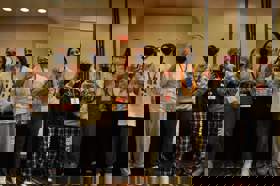 Group of people celebrating on stage