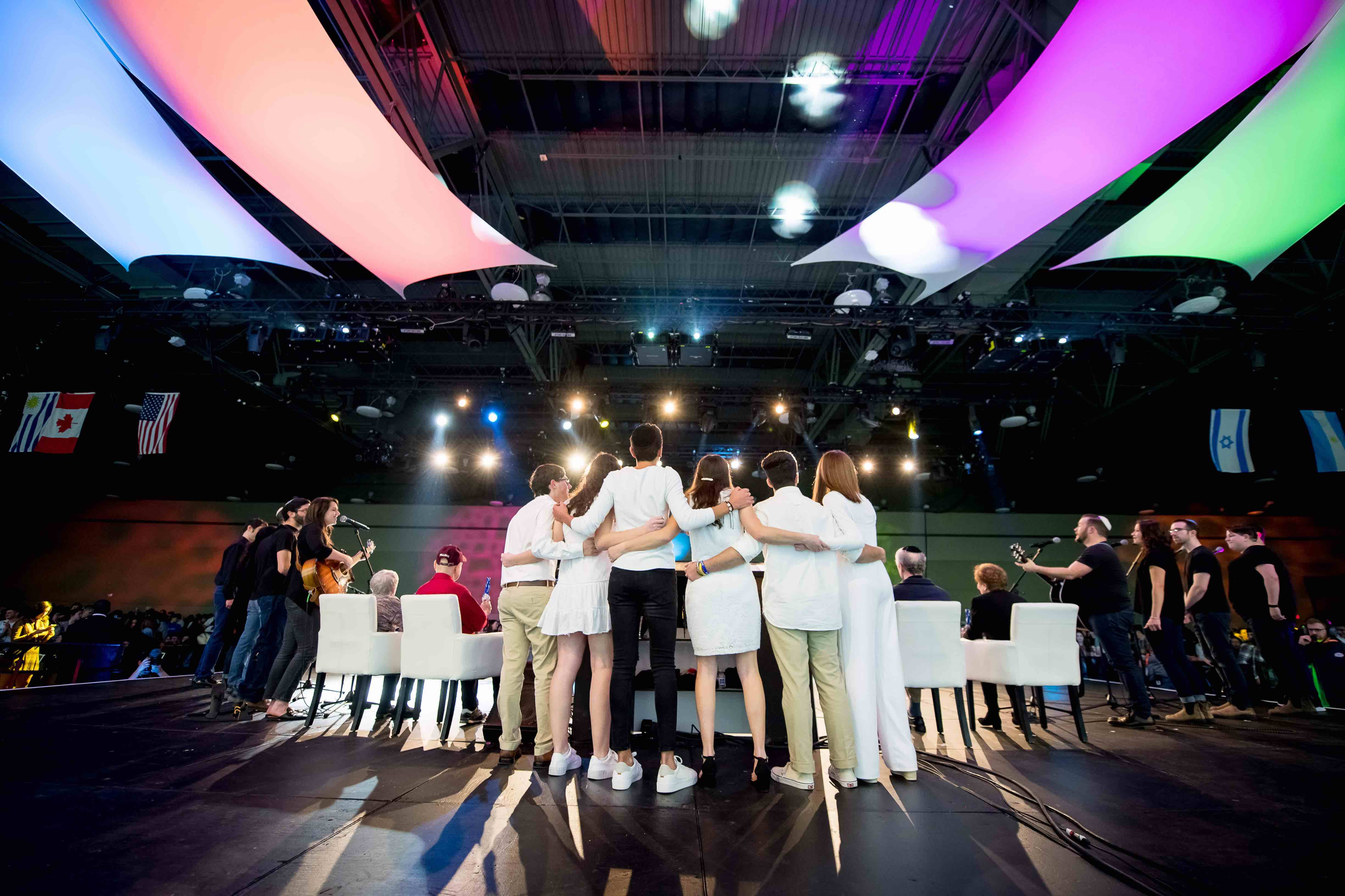 Group of people celebrating on stage