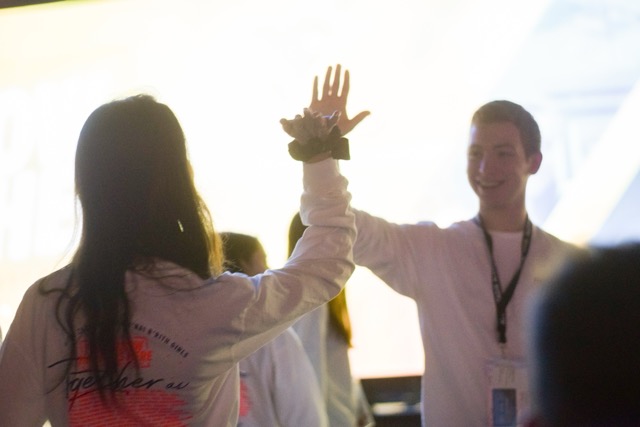 Group of people celebrating on stage