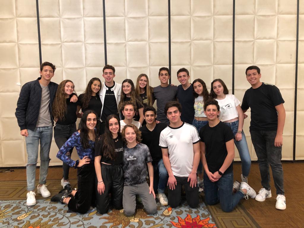 Group of people celebrating on stage