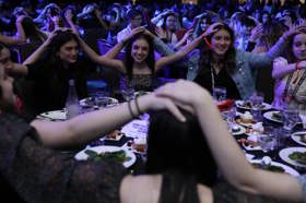 Group of people celebrating on stage