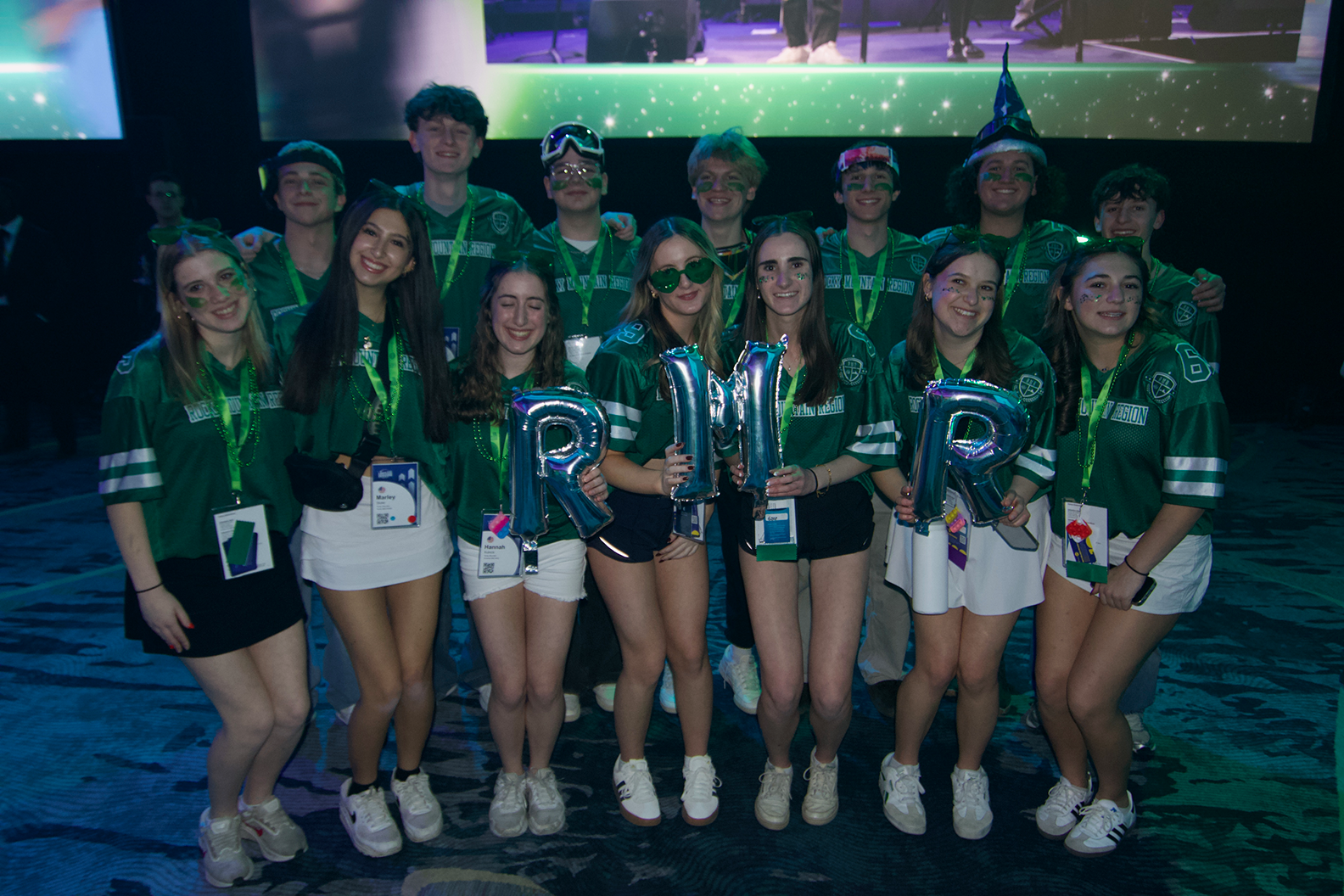 Group of people celebrating on stage