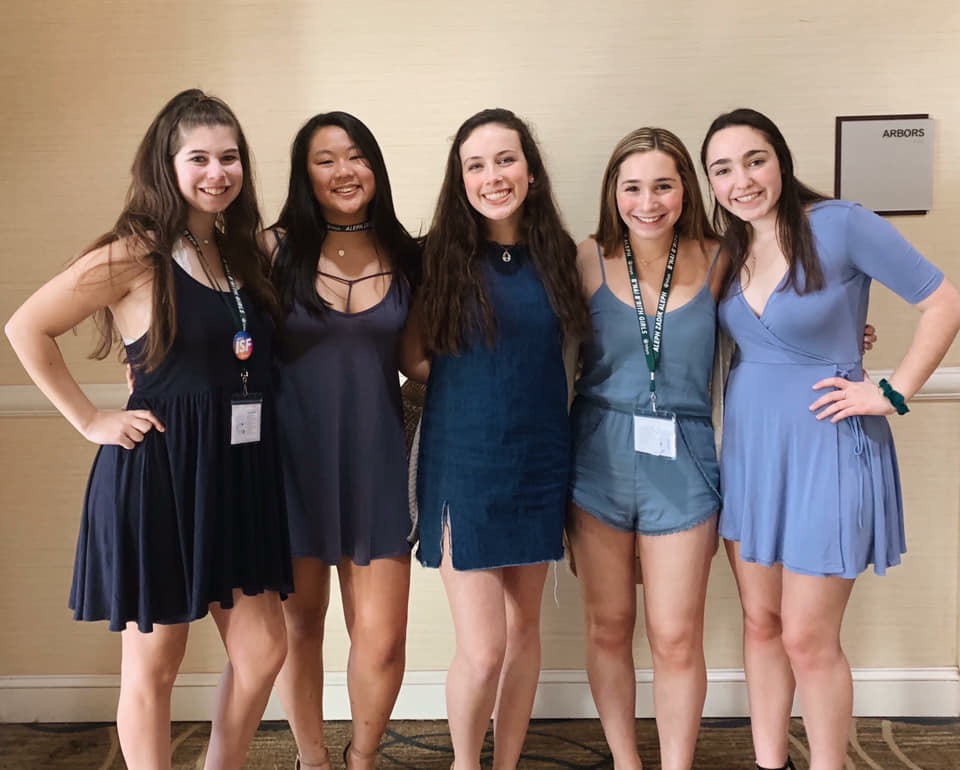 Group of people celebrating on stage