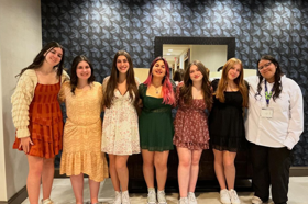 Group of people celebrating on stage