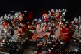 Group of people celebrating on stage