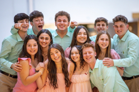 Group of people celebrating on stage
