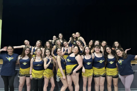 Group of people celebrating on stage