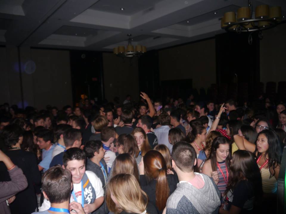 Group of people celebrating on stage