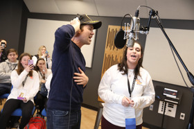 Group of people celebrating on stage