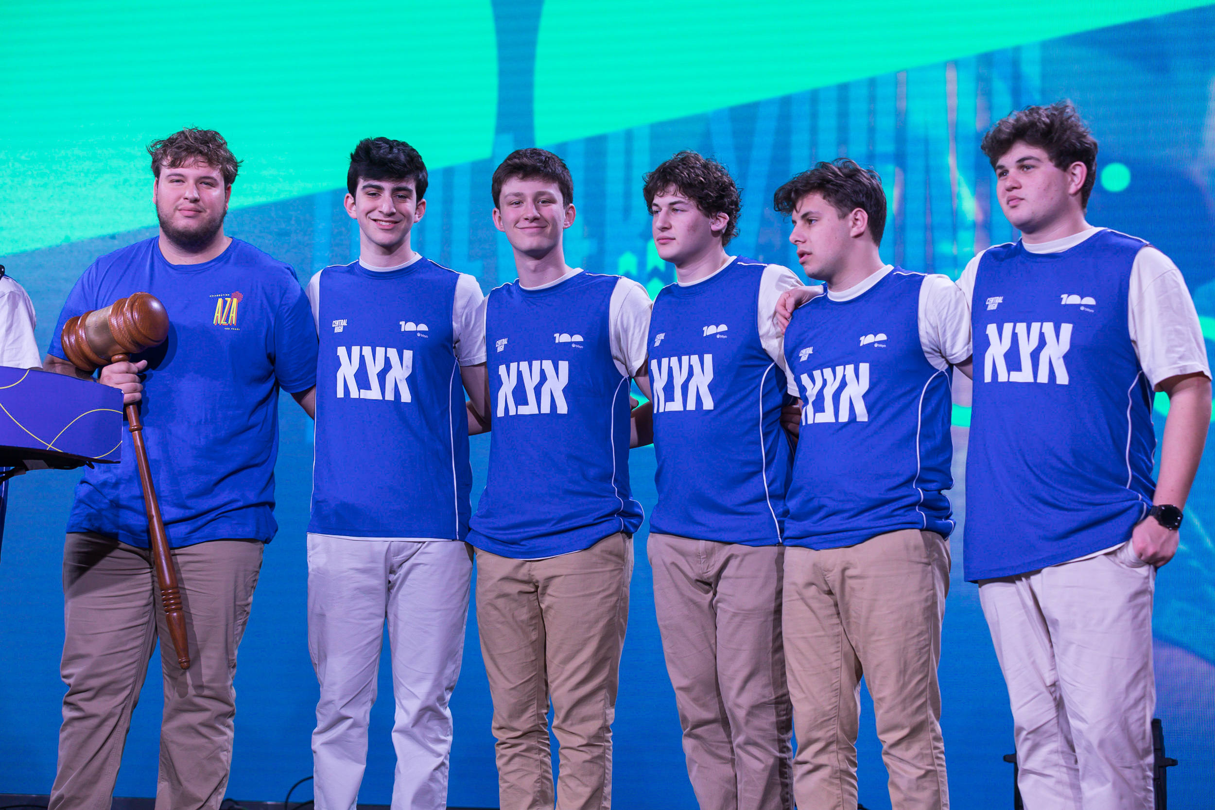 Group of people celebrating on stage