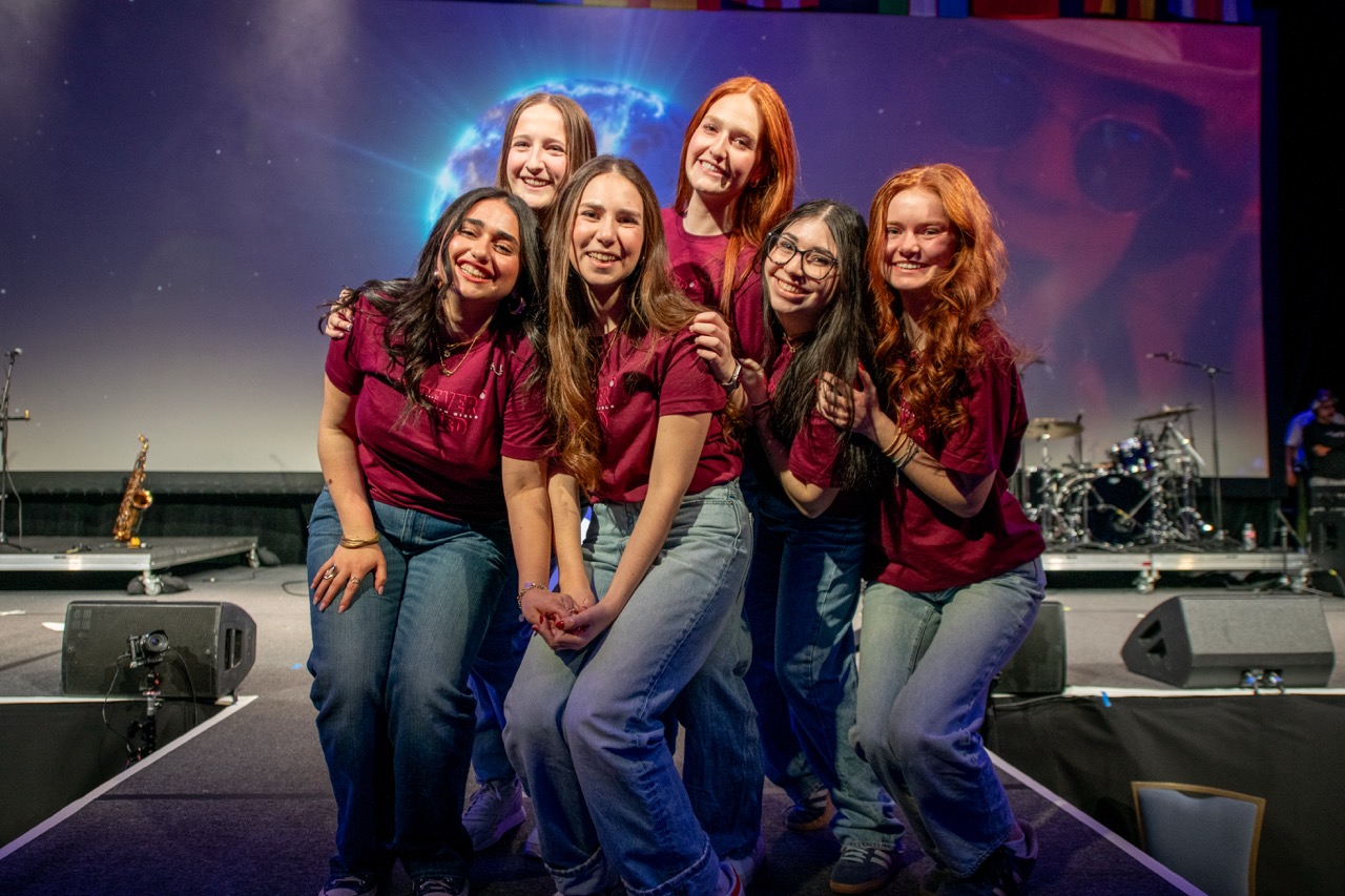 Group of people celebrating on stage