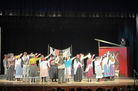 Group of people celebrating on stage