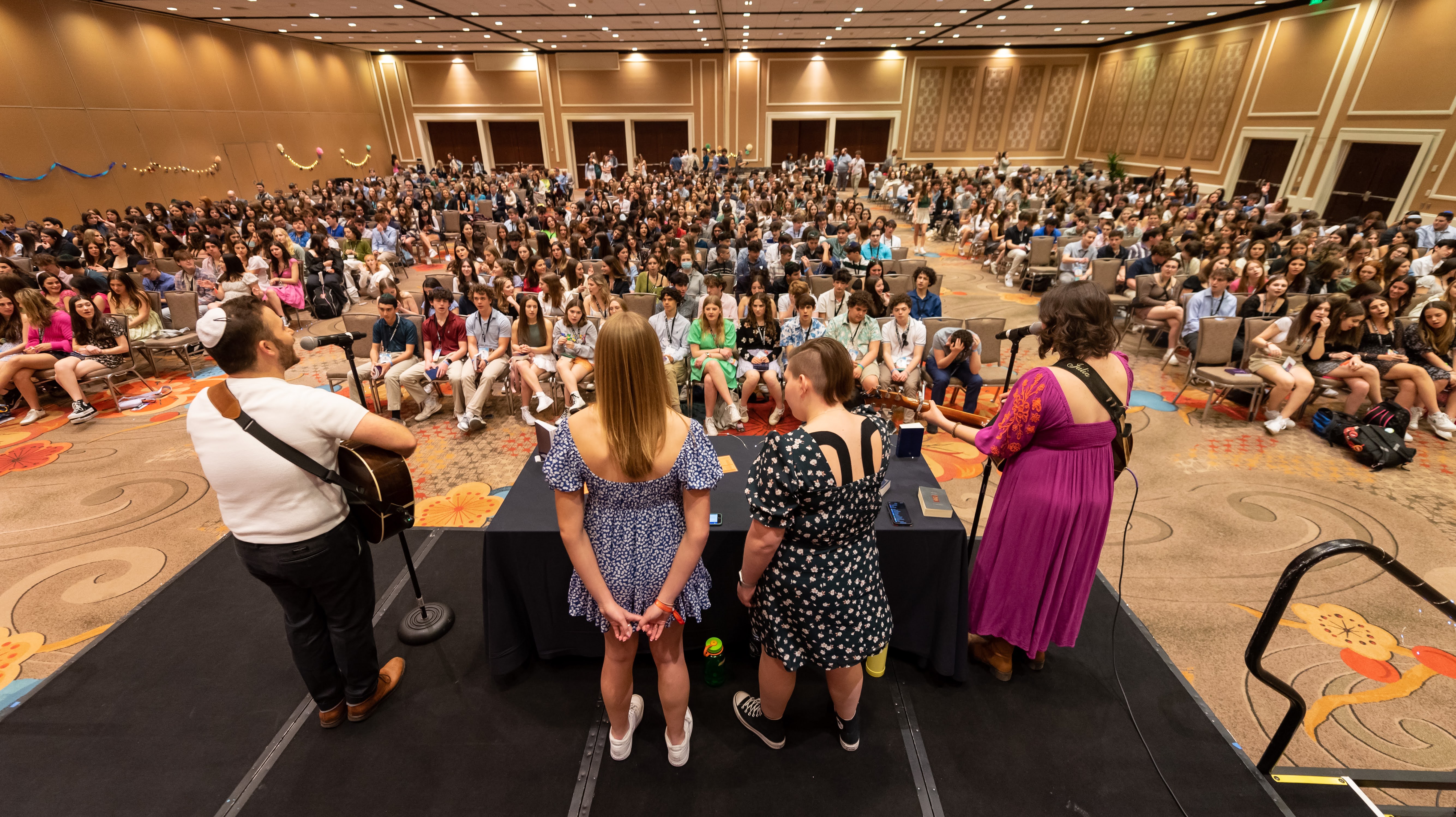 Group of people celebrating on stage