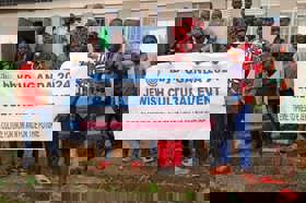 Group of people celebrating on stage