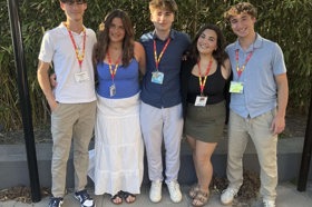 Group of people celebrating on stage