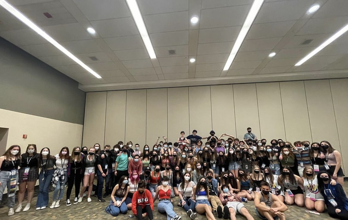 Group of people celebrating on stage