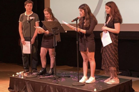 Group of people celebrating on stage