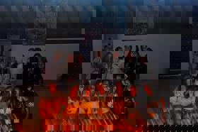 Group of people celebrating on stage