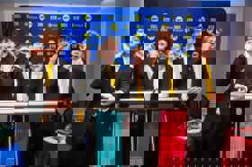 Group of people celebrating on stage