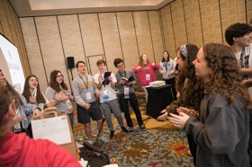 Group of people celebrating on stage