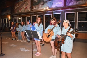 Group of people celebrating on stage