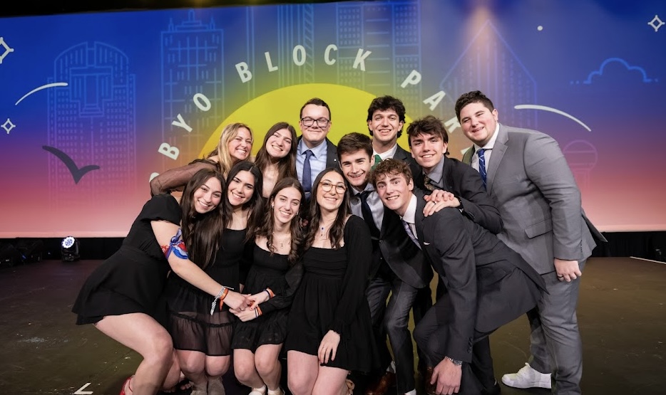 Group of people celebrating on stage