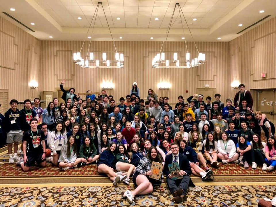 Group of people celebrating on stage