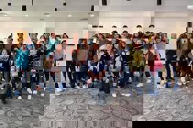 Group of people celebrating on stage