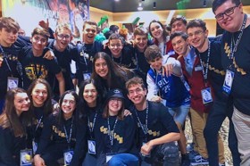 Group of people celebrating on stage