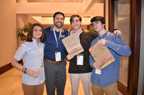 Group of people celebrating on stage