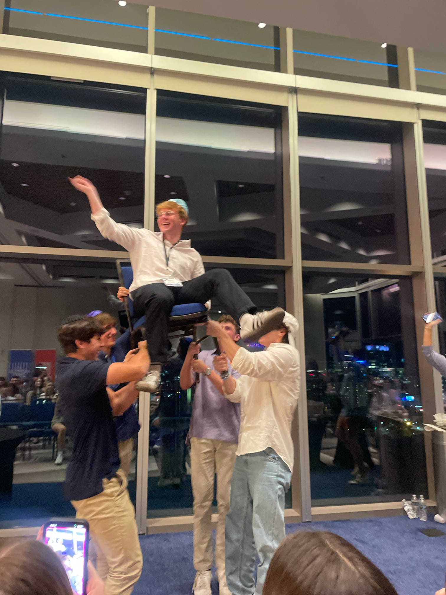 Group of people celebrating on stage