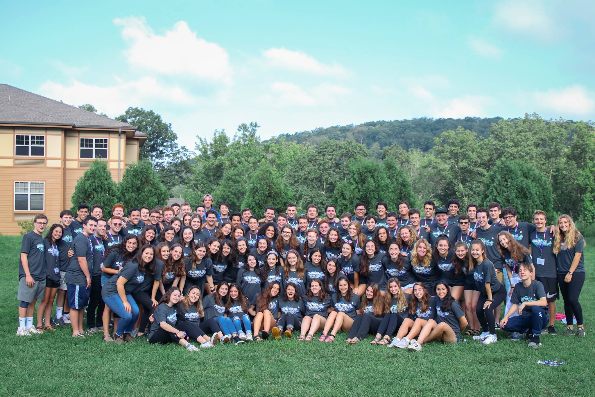 Group of diverse young people smiling at a community event