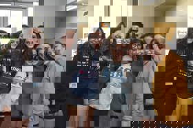 Group of people celebrating on stage