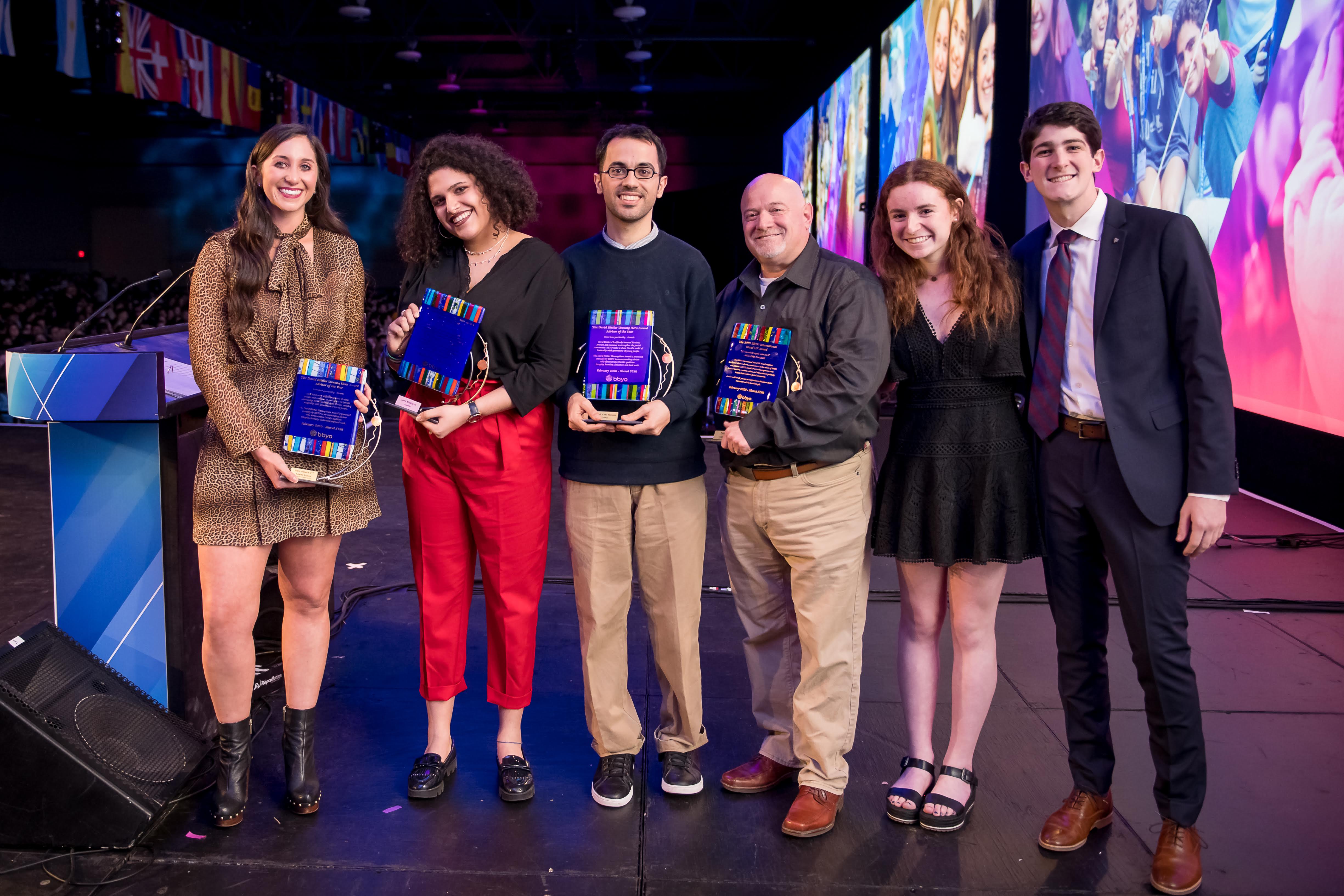 Group of people celebrating on stage
